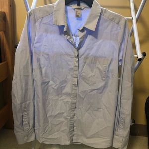 Blue button up shirt with white strips